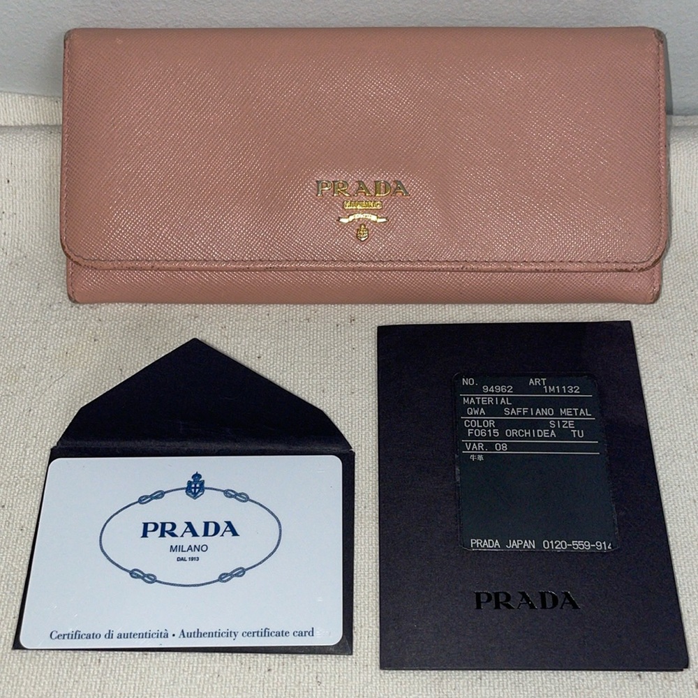 Authentic PRADA Milano pink long wallet saffiano leather with gold details.
